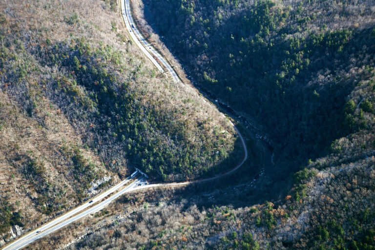 A pre-Helene aerial view shows I-40’s winding path through the rugged Pigeon River Gorge.